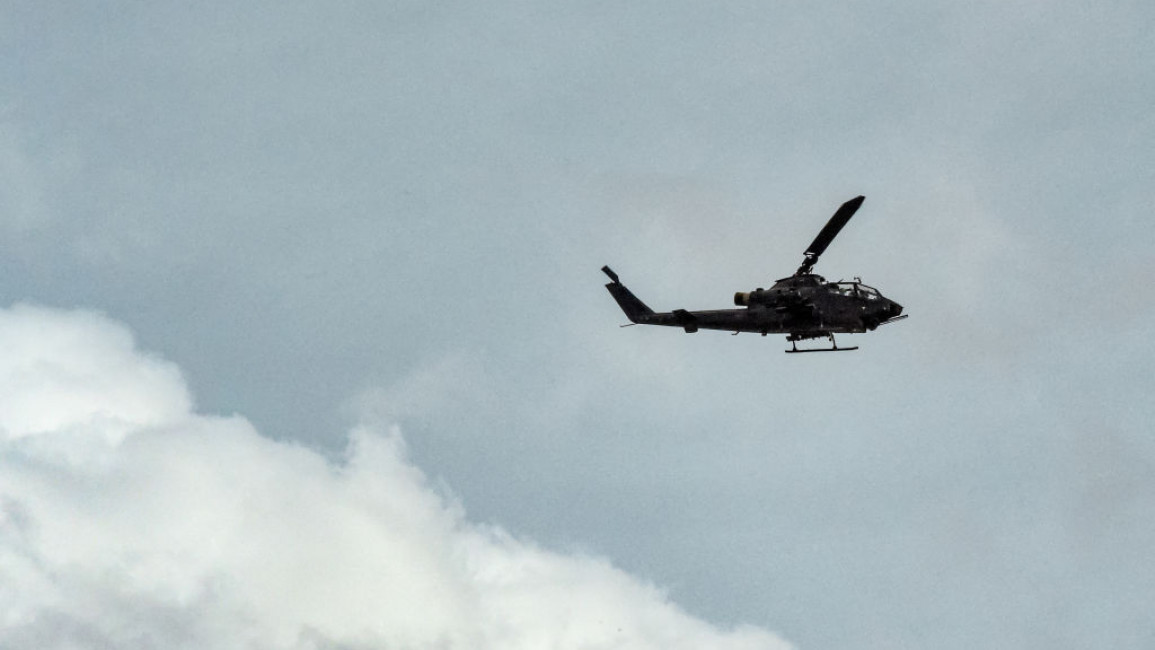 An army helicopter conducts a search operation following an attack by armed separatist group Balochistan Liberation Army (BLA) at central Bolan district in Balochistan province