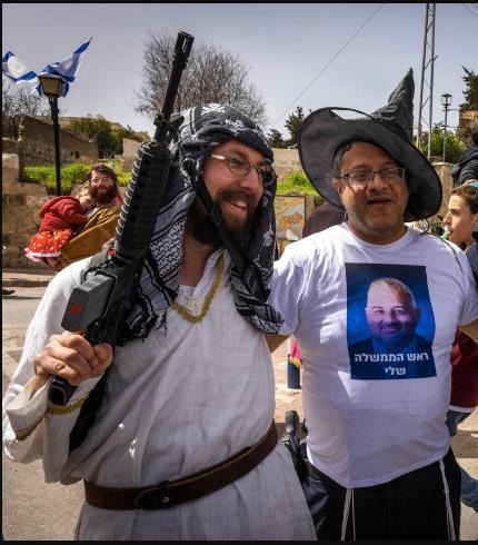 Saadia Hershkop (left) next to Ben-Gvir (right) in Hebron, as they celebrate Purim, a Jewish holiday, in March 2022. [Mekomit/Olivia Pitosi/Flash90/fair use]