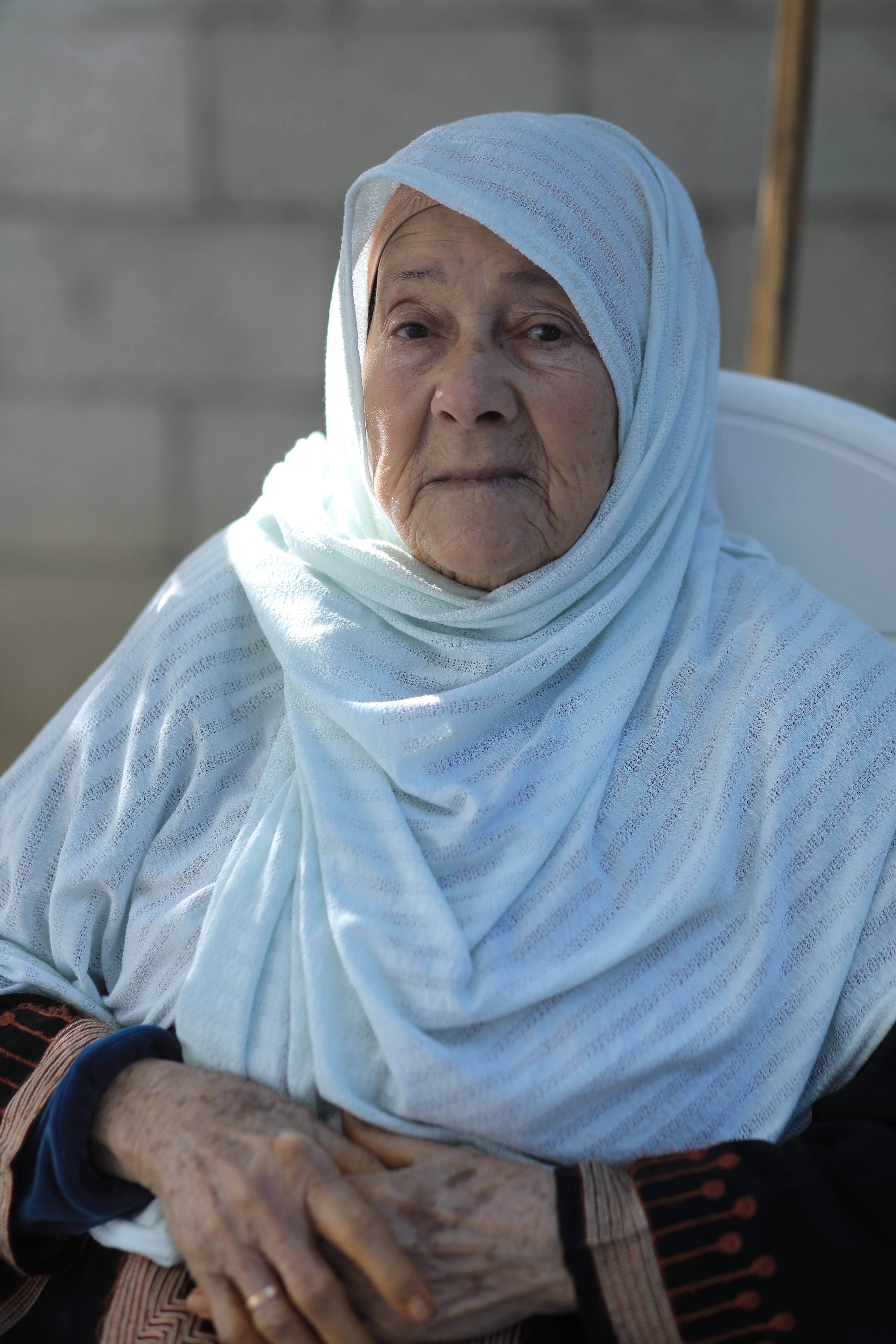 Dalal Nassar, a 84-year-old Palestinian refugee elderly woman