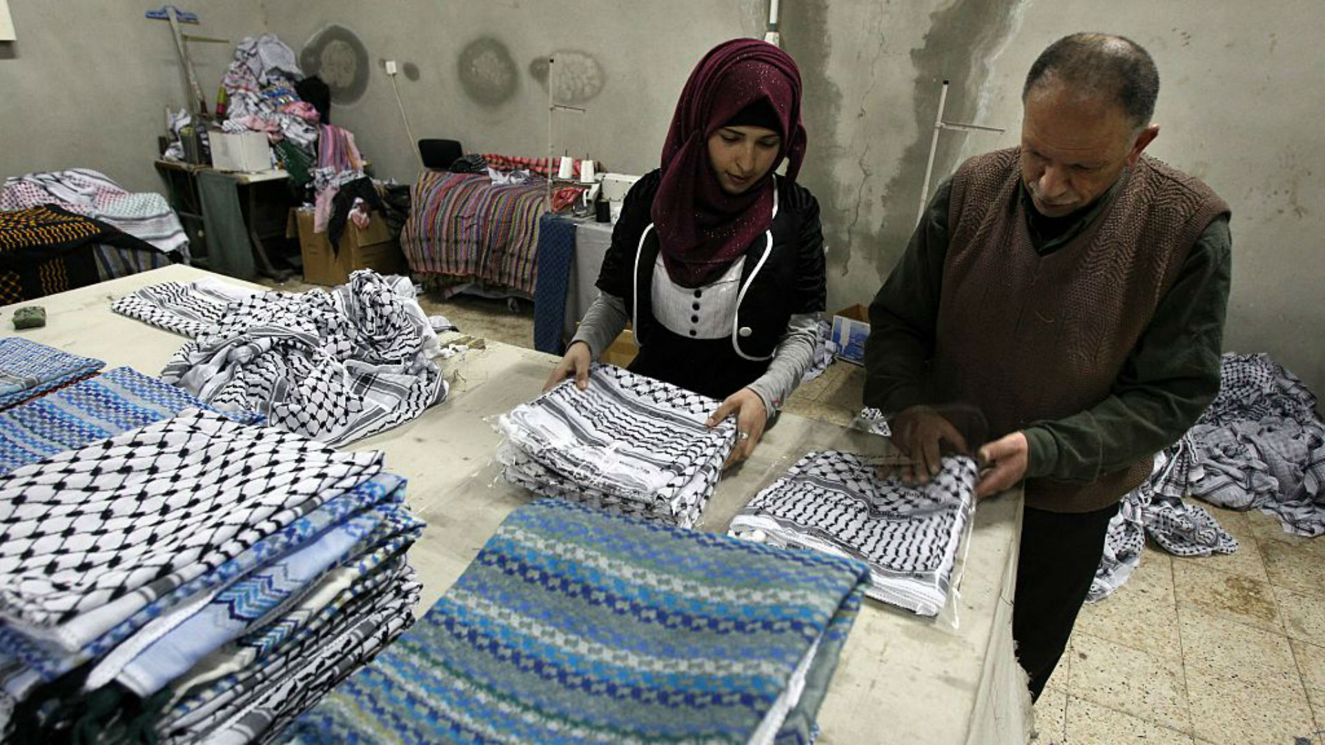 Young man wearing a palestinian keffiyeh scarf