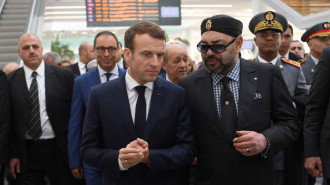 Moroccan King Mohammed VI (R) and French President Emmanuel Macron (L) speak after inaugurating a high-speed line at Rabat train station on November 15, 2018.