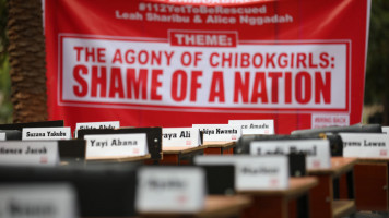 A banner for and the names of Nigeria's remaining Chibok girls.