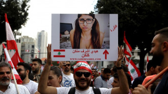 A Lebanese man holds a picture of Lebanese porn actress Mia Khalifa