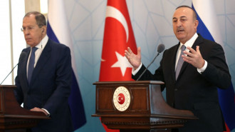 Russia's Foreign Minister Sergei Lavrov (left) stands next to his Turkish counterpart, Mevlut Cavusoglu (right).