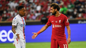 Mo Salah (right) and Tyrick Mitchell (left).