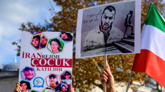 Toomaj Salehi, an Iranian rapper, on a sign