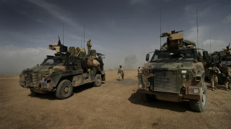 Australian soldiers arrive at Tarin Kowt after completing a patrol in the Baluchi Valley