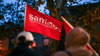 A photo shows a flag of the pro-Palestine organization 'Samidoun' during a "in solidarity with Gaza" demonstration in Duisburg, western Germany, on October 9, 2023. 