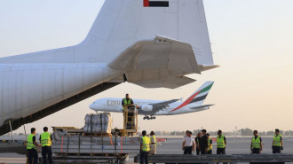 An Emirates cargo plane is loaded with aid for the Palestinian Gaza Strip at the airport in Dubai before flying to the Egypt-Gaza border city of el-Arish, in Egypt's north Sinai Peninsula on October 17, 2023,