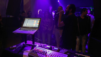 Egyptian musician Abdullah Miniawy (R) performs at a nightclub in Cairo, on October 26, 2016 [Getty]