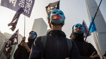 Protesters attend a rally in Hong Kong to show support for the Uighur minority in China on 22 December, 2019. [Getty]