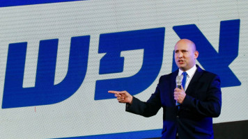 Naftali Bennett, leader of the Israeli right-wing 'New Right' party, speaks onstage during a campaign rally on 17 March 2021. [Getty]