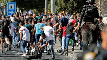 Israeli security forces attacked Palestinian protesters near the Damascus Gate [AFP]