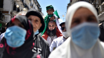 Algerians shout slogans during an anti-government demonstration in the capital Algiers on May 7, 2021. (Photo by RYAD KRAMDI / AFP) (Photo by RYAD KRAMDI/AFP via Getty Images)