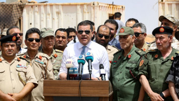 Prime Minister Abdul Rahman Dbeibah (centre) was previously prevented from visiting eastern Libya by Haftar's forces [Getty]