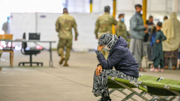 Recently-arrived refugees from Afghanistan waiting for medic support at a temporary camp at the U.S. Army's Rhine Ordnance Barracks (ROB), where they are being temporarily housed, on August 30, 2021 in Kaiserslautern, Germany [Getty Images]