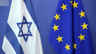 An Israeli flag is set next to a European Union flag at the European Union Commission headquarters in Brussels in 2016. [Getty]