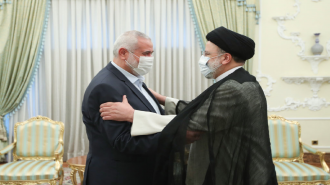 Hamas leader (L) and Iran president