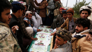  Houthi followers ride a vehicle carries coffins of Houthi fighters after their funeral procession on September 29, 2021 in Sana'a, Yemen [Getty Images]