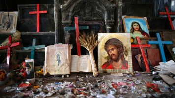 Crucifixes and icons are seen at the heavily damaged Church of the Immaculate Conception in Qaraqosh on April 9, 2017, as Christians mark the first Palm Sunday event since its recapture from IS.