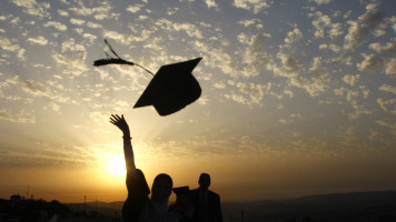 Palestinian students celebrate during their graduation ceremony at al-Najaf University near the northern West Bank city of Nablus on June 7, 2010. [Getty]