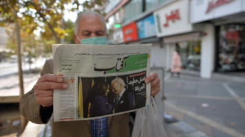 A view from Tehran's street as a citizen reading the news regarding the U.S. elections in newspapers, on November 09, 2020 in Tehran, Iran [Getty Images]