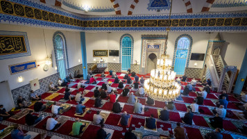 Muslims gather during morning prayers for Eid al-Adha at The Mevlana Mosque in Rotterdam [Getty[