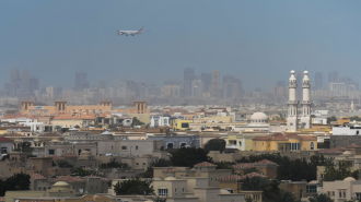 Plane flies over Dubai