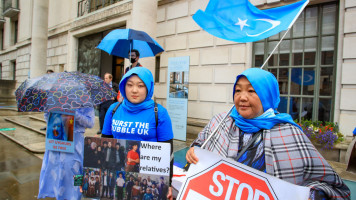 People gather outside the Chinese Embassy in central London during a demonstration in support of Uighur people over ongoing human rights violations in China's Xinjiang autonomous region, in London, United Kingdom on August 05, 2021