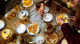 Thanksgiving dinner is served at Sufi Mumim's restaurant November 22, 2001 in Talaquan, Afghanistan. Prepared dishes include roast turkey with pumpkin and yoghurt and Afghan staples such as sweet green tea and bread