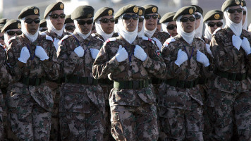 Jordanian veiled women soldiers participate in the first military parade since King Abdullah II ascended the throne seven years ago, during celebrations to mark the 85th anniversary of Jordan's armed forces, 10 June 2006