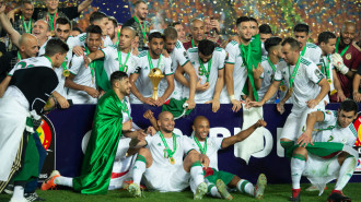  Algeria captain Riyad Mahrez lifts the trophy as his team celebrate winning the 2019 Africa Cup of Nations Final between Senegal and Algeria