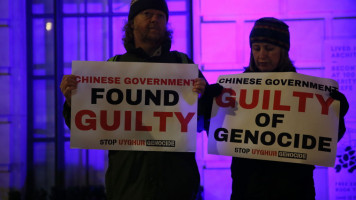 People stage a protest in front of the Chinese Embassy after the Uyghur Tribunal ruled that China committed genocide against Uyghurs and other ethnic minorities through policies such as coerced birth control and sterilization in London, United Kingdom