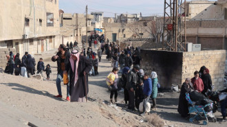 Dozens of people fled the fighting between IS and the SDF in Hasakeh [Getty]