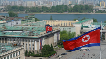 A North Korean flag is seen blowing in the air in Pyongyang