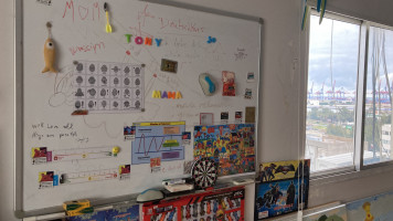 A whiteboard in Dr Anita Toutikian's art therapy room, the red cranes of Beirut's port seen through the window, where the explosion of August 2020 took place 