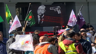 Supporters of the PKK hold placards reading "Kill Erdogan" in Swiss capital