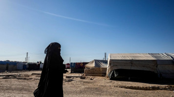 Clashes broke out between women and SDF guards in the Al-Hol camp [AFP]