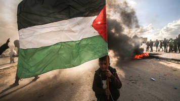 A boy seen holding a Palestinian flag, during the demonstration. Palestinians seen protesting in Rafah, in the southern Gaza Strip against Israel's confiscation of Palestinian lands and its razing in the Negev desert in southern Palestine. 