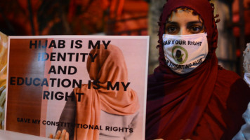 A woman take to the street and held a candlelight march to protest against Karnataka hijab ban in educational institutions.