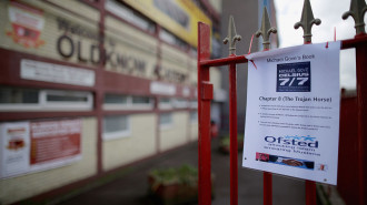 A poster against Education Secretary Michael Gove is displayed on the railings outside Oldknow Academy, one of the Birmingham Schools at the centre of the 'Trojan Horse' inquiry on June 10, 2014 in Birmingham, England. British prime minister David Cameron has today set out values that he believes should be taught in British schools after allegations of a "Trojan Horse" extremism plot in Birmingham schools.