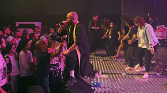 Iraqi-Canadian hip-hop artist Yassin Alsalman, known by his stage name Narcy, performs the chobi, an Iraqi folk dance, to his Arabic and hip-hop beats on stage at the Dubai International Marine Club during a music festival in the United Arab Emirates