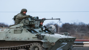 A Russian military column moves across the town of Armyansk, northern Crimea