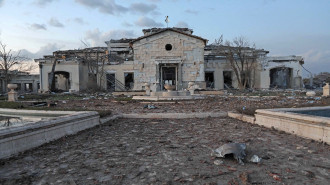 A general view shows a damaged mansion 