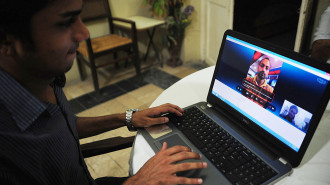 A Pakistan man chats with his friend on an online network in the port city of Karachi on October 3, 2013. Pakistan's southern Sindh province will block access to online communication networks including Skype and WhatsApp for three months in a bid to curb terrorism