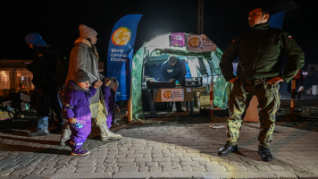 Civilians from Ukraine arrive at the Medyka border crossing in Poland