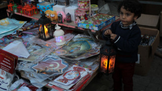 Palestinians shop for decorations in Al-Zawya old market in Gaza City, in preparation of the upcoming Muslim holy fasting month of Ramadan