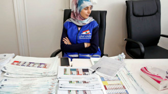 A Lebanese election official sits at a polling station at the Lebanese embassy in Tehran on May 6, 2022. - Lebanese expatriates began casting their votes today for parliamentary elections, state media said, two years into an unprecedented economic crisis that spurred a mass exodus