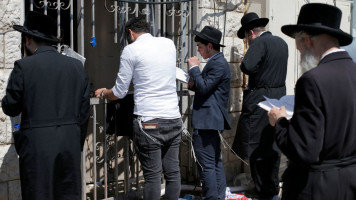 Jewish men praying at Mount Meron in Israel