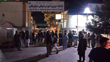 Relatives of bombing victims gathered outside a hospital in Mazar-i-Sharif [Getty]